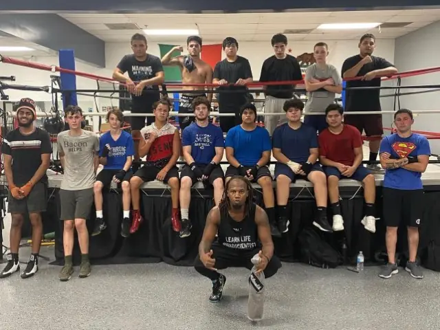 The Dethrone boxing team gathered around the ring.