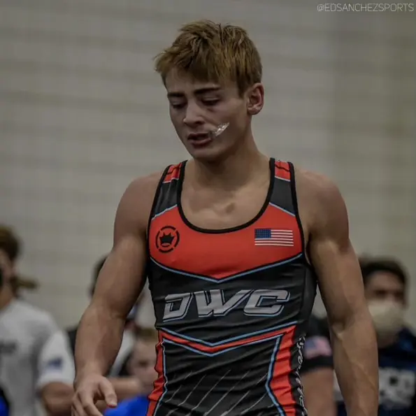 A Dethrone Wrestling Club wrestler in a DWC singlet at a tournament.